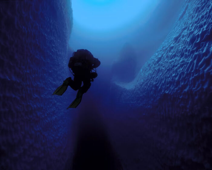 A Photo Of A Diver Exploring The Underside Of An Iceberg In Antarctica By Jill Heinerth. Apparently, They Went Inside A Cave In This Giant Iceberg. I Couldn't Imagine "Cave" Diving Inside An Iceberg That Floats In Nearly Black Water