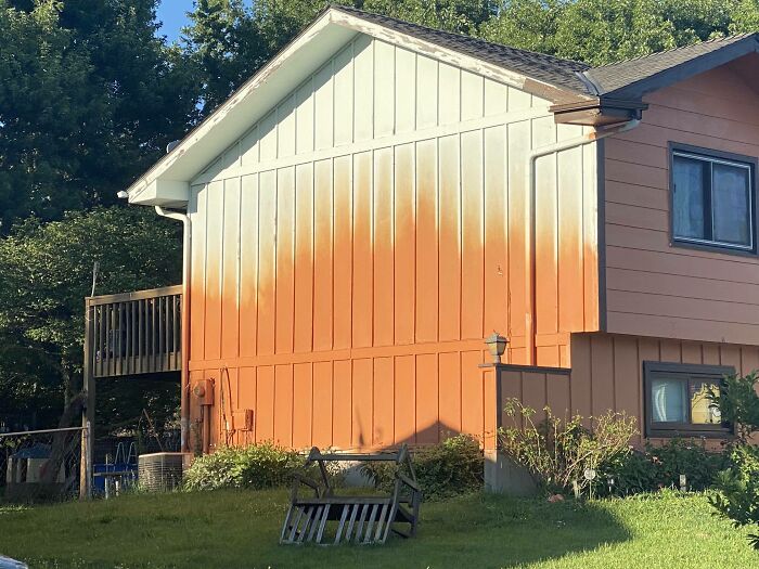 A Couple Years Ago, My Neighbor Decided To Paint His House Bright Orange... Then Gave Up Halfway Through