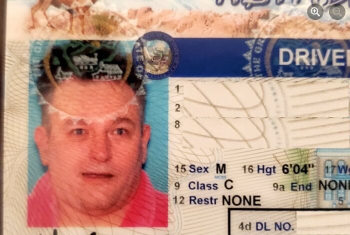 I Have A Long-Standing Battle With My Buddy For The Most Ridiculous Photo Id. My Wife Suggested I Wear My Mother's Hot Pink Bathrobe And "Gary Busey" My Hair For My New Driver's License Photo, So I Did.