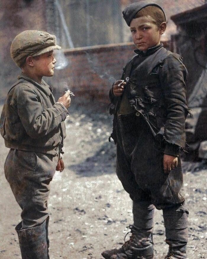 Two Young Boys Smoking In 1916 During Ww1. Nothing More Is Known About These Two Boys Who Are Dressed In Bits Of German And French Uniform, Apart From The Fact That It Was Photographed Near A German Prisoner Of War Camp In Douchy, France.