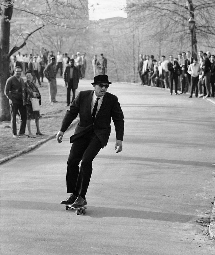 A Skateboarder Zipping Through Central Park In The 1960s