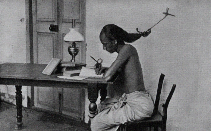 An Indian Student Studying Late At Night At The University Of Madras In Tamil Nadu, 1905