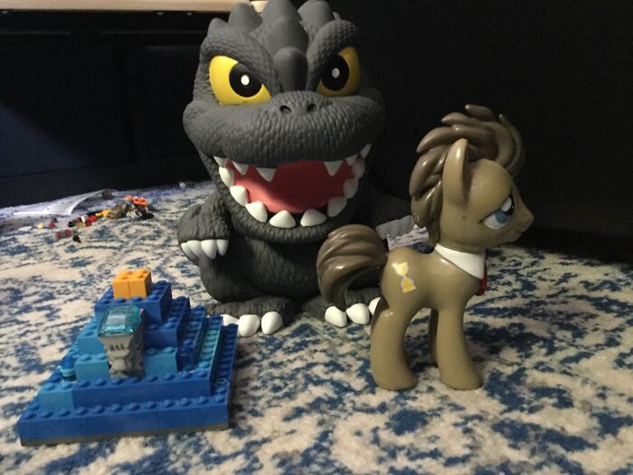 Couldn’t Decide So Here’s 3 My Godzilla Piggy Bank,my LEGO Blue Pyramid I Made Cuz I Was Bored And My Dr.hooves Statue