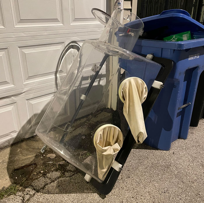 Large Plastic Hood With Gloves Attached. Found In Chicago Residential Alleyway