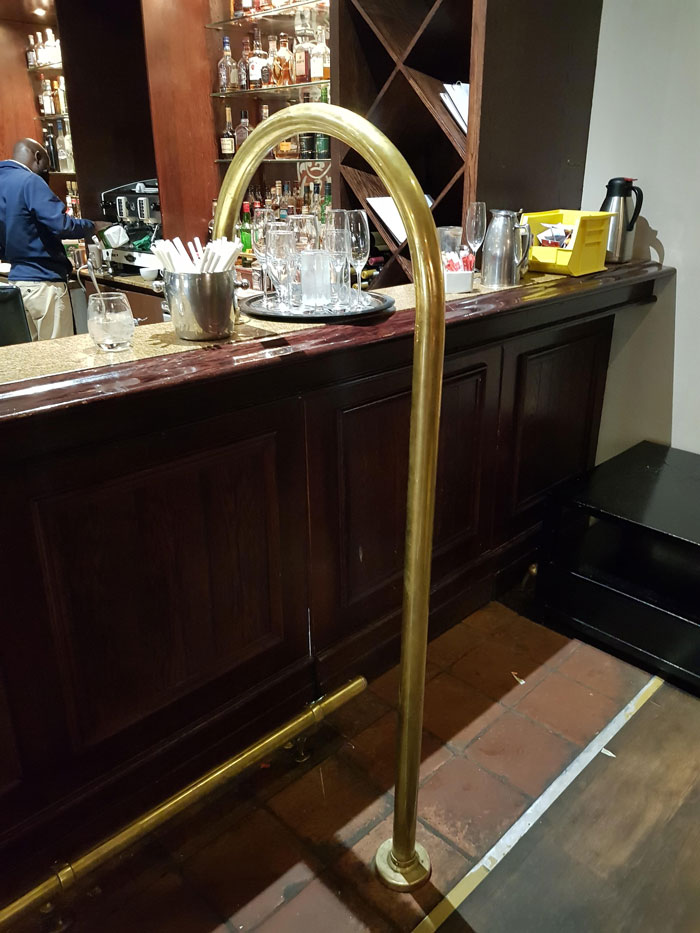 I've Seen This Cane Shaped (Usually) Brass Post At Numerous Bars And Pubs, And Wondered What It Is And What It Is Used For. L Have Been Unable To Google The Correct Sequence Of Words To Get A Result
