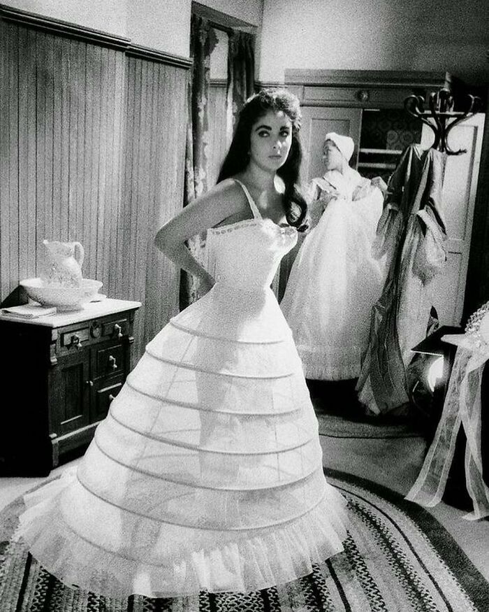 Elizabeth Taylor Getting Into Costume On The Set Of Raintree County, 1957