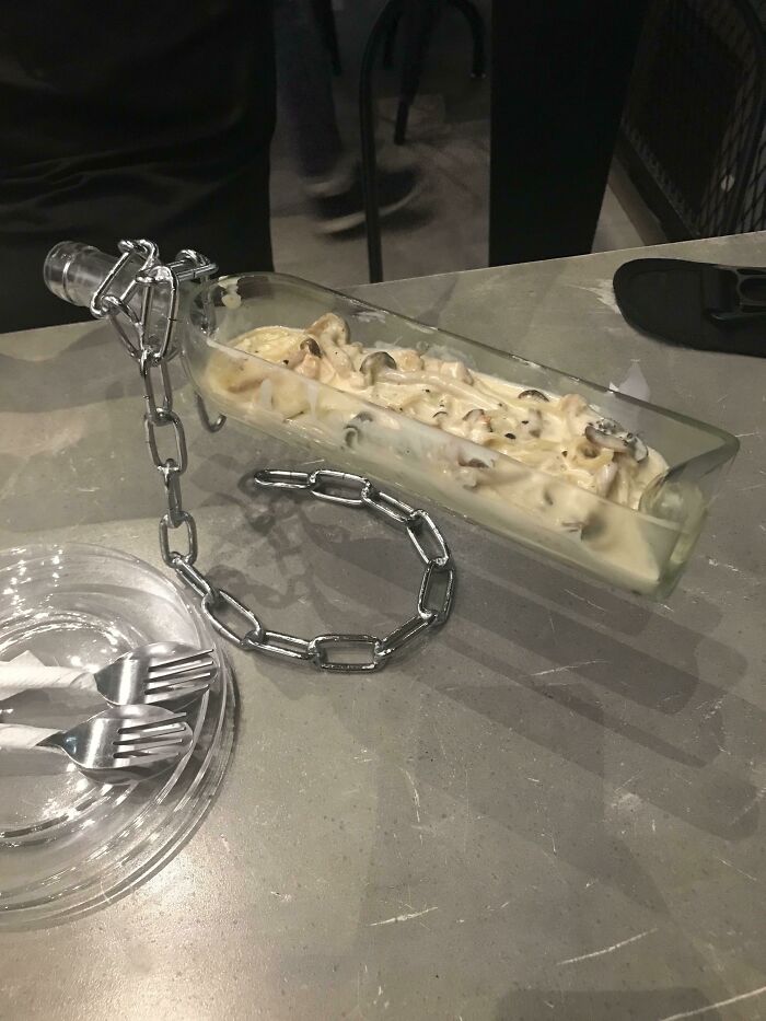 Pasta Served In A Bottle That Is Levitating On A Chain