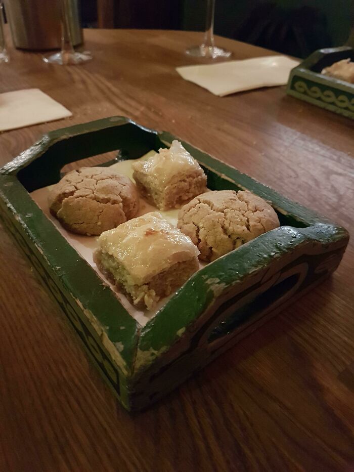 Assorted Pastries On A Wooden Tray With A Side Of Paint Chips
