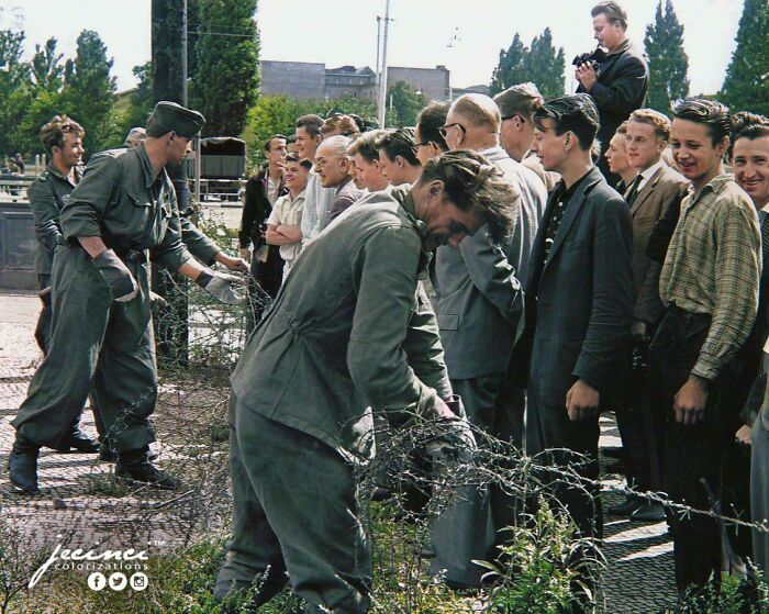 East German Soldiers Set Up Barbed-Wire Barricades, At The Border Separating East And West #berlin, While West Berlin Citizens Watch. - August 13, 1961