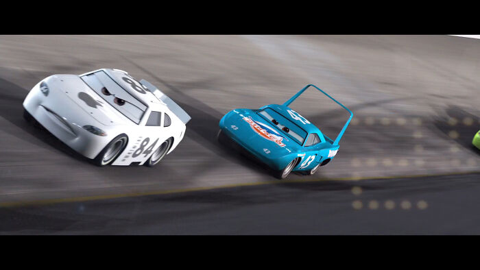 In Cars (2006) You Can See An Apple Sponsored Racer On The First Race Scene