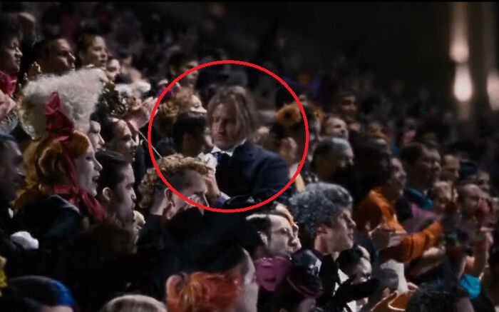 In The Hunger Games (2012) Haymitch Can Be Seen In The Crowd During The Tributes Parade Smelling A Flower Instead Of Throwing It Out To The Tributes, Since He's From District 12 And Not The Capitol