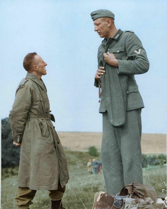 7-Foot-Tall (2.10m) Captured German Soldier, Jacob Naken, Talking With A Canadian Soldier In Calais, France On 29 September 1944