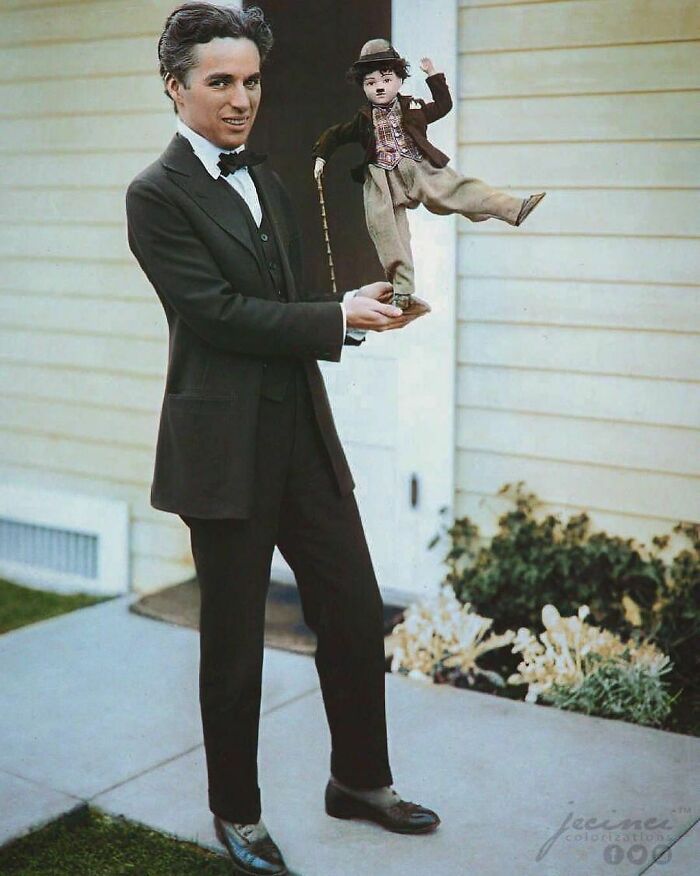 Charlie Chaplin, Famous Actor And Film Producer Of The Silent Era, Holding A Puppet Version Of His Character “The Tramp” In C. 1914