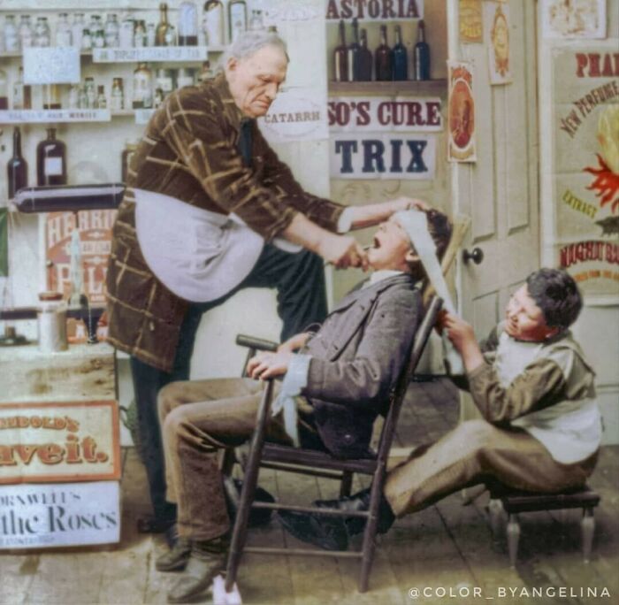 Tooth Extraction Taking Place In A Liquor Store In 1872. An Assistant Is Holding The Person's Head In Place With A Towel While The "Dentist" Uses Pliers To Remove The Tooth