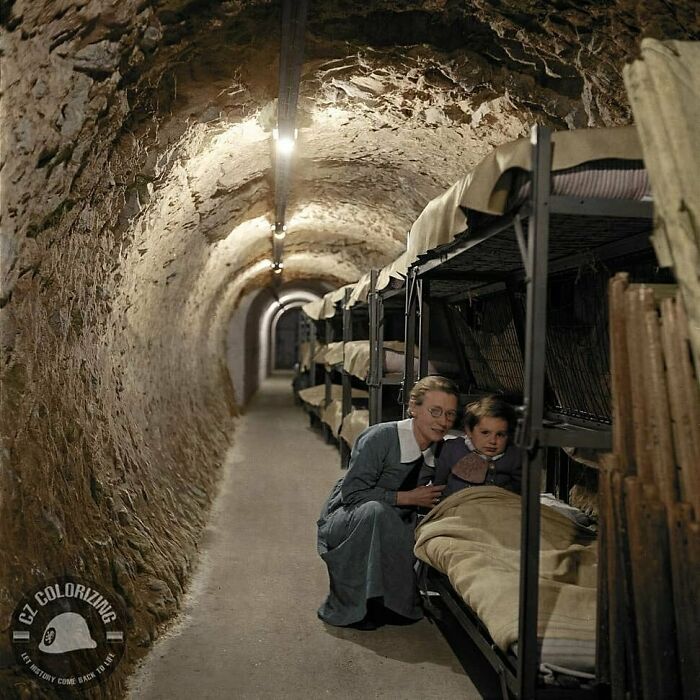 A Woman With A Young Child In A Sleeping Area Set Up In A Underground Station In London, England As An Air Raid Shelter During World War II, C. 1941