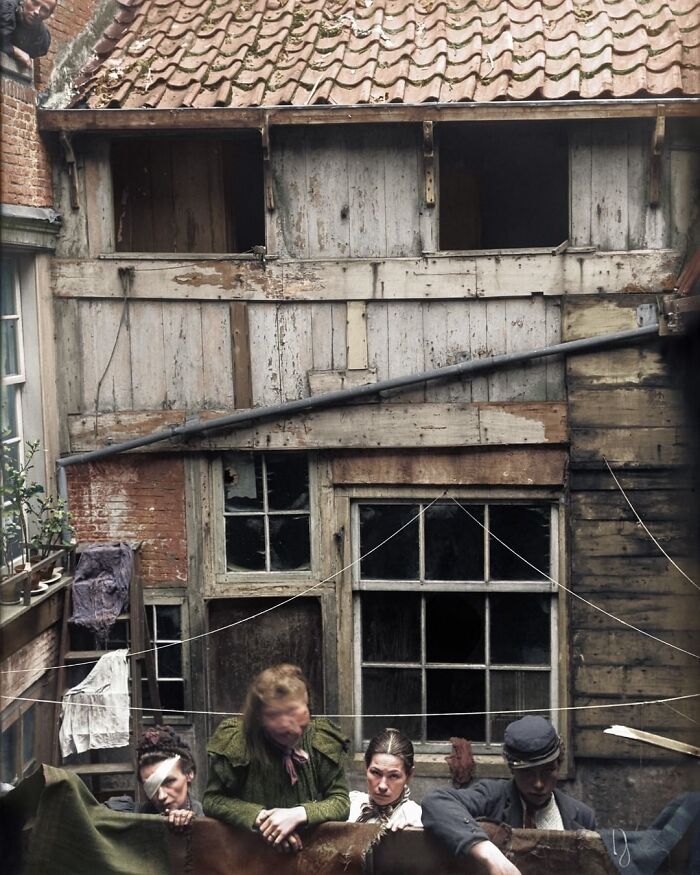 Four Women Photographed Outside A House In The Slums Of Amsterdam, The Netherlands In 1899. The Photograph Was Taken By The Health Service In Preparation For An Uninhabitable Declaration