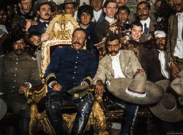 Mexican Revolutionary Leaders Pancho Villa And Emiliano Zapata Sitting Next To Each Other At Palacio Nacional In Mexico City, Mexico On The 6 December 1914. Villa Is Sitting In The Presidential Chair
