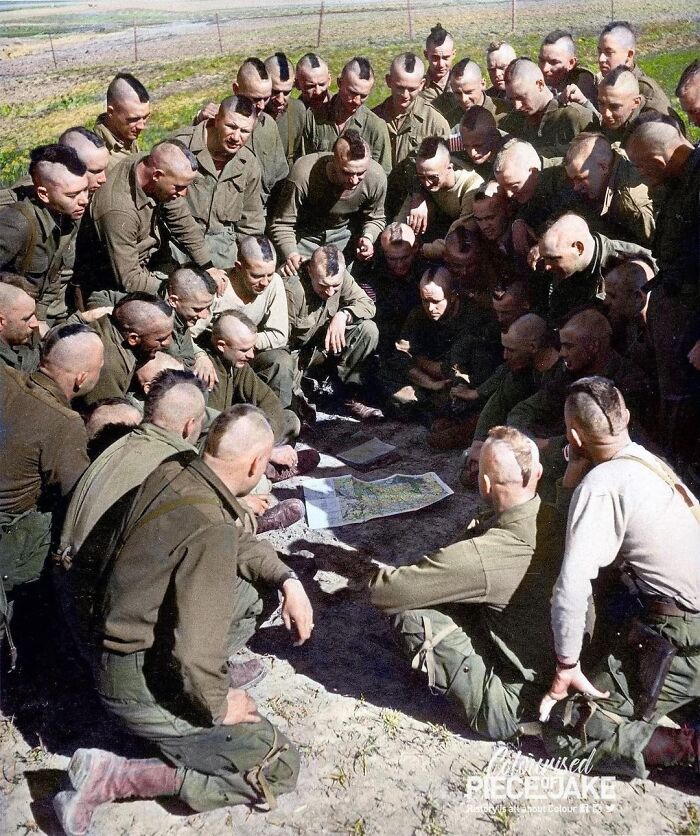 Us 17th Airborne Paratroopers, With Their Hair Cut In Mohawk-Style, Being Briefed For The Next Day's Jump Across The Rhine, Arras, France. Photograph Taken On The 23 March 1945