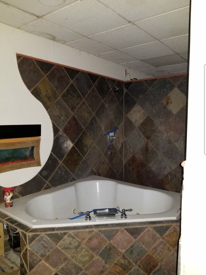 This Is A Picture Of The Master Bath Of A House We Bought At The Foreclosure Auction A Few Years Ago. The Whole Bathroom Was Makeshift And Thrown Together. Zoom In To The Left, That's A Fish Tank In The Wall!