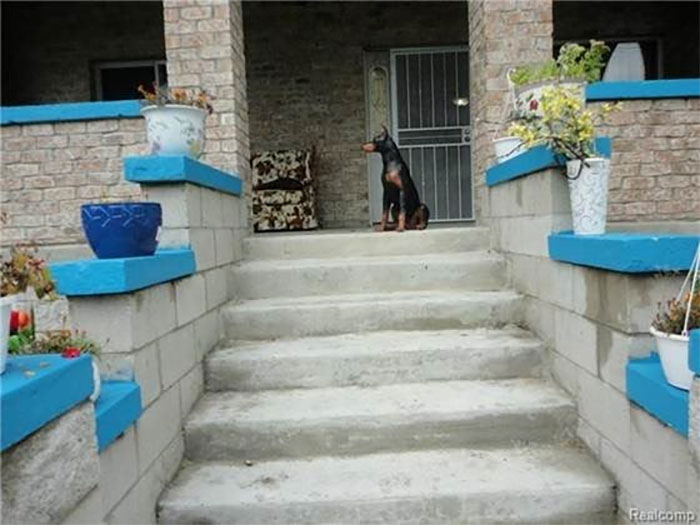 Nothing Says Curb Appeal Like A Ceramic Dog On The Front Porch