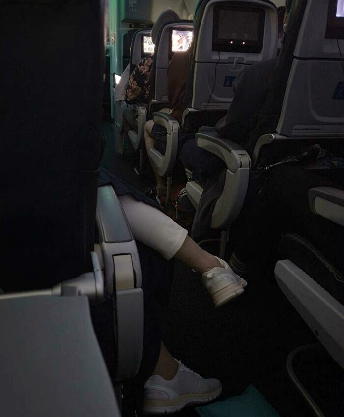 This Woman Was Like This For Hours Making People Step Over Her. Until A Flight Attendant Finally Made Her Move