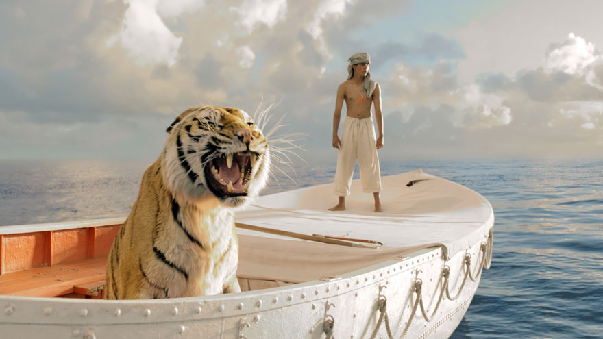 A young man with a tiger in a white boat is in the waters