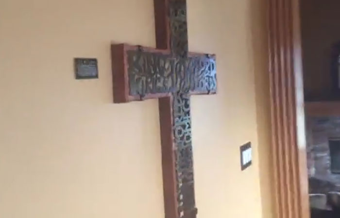 'A life-size crucifix in one of the bedrooms': Airbnb guest was stunned to find her entire rental home filled with Christian decor
