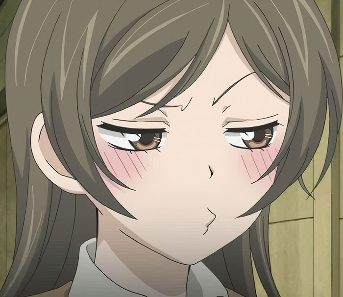 Close-up of a female anime character with a pouty expression and blushing cheeks, showcasing fan-favorite traits.