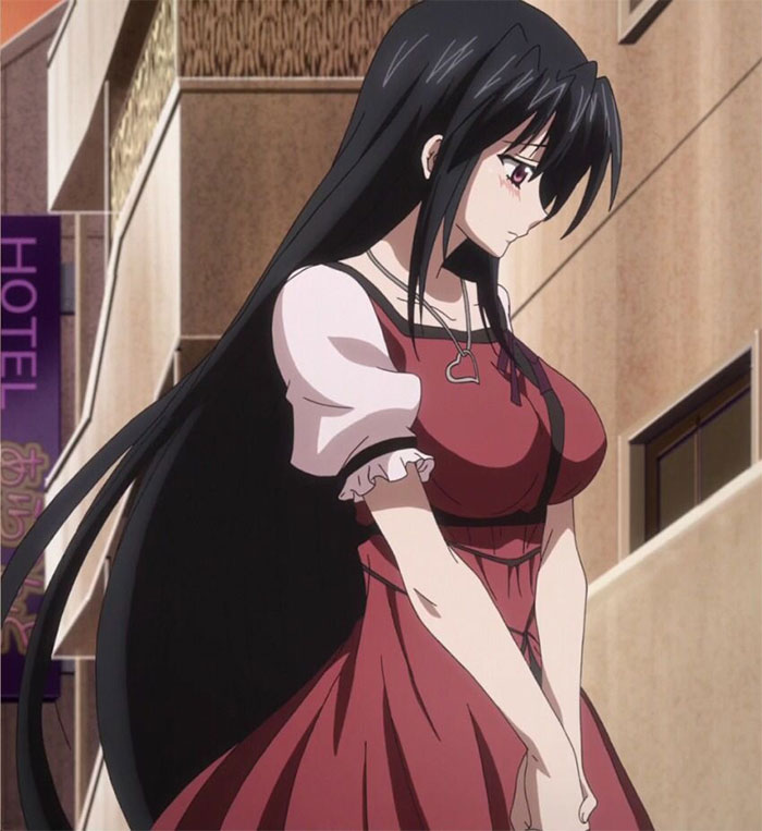 Female anime character with long black hair and red dress, standing thoughtfully in an urban setting.