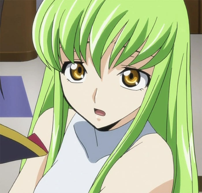 Female anime character with long green hair and golden eyes, looking surprised or engaged.