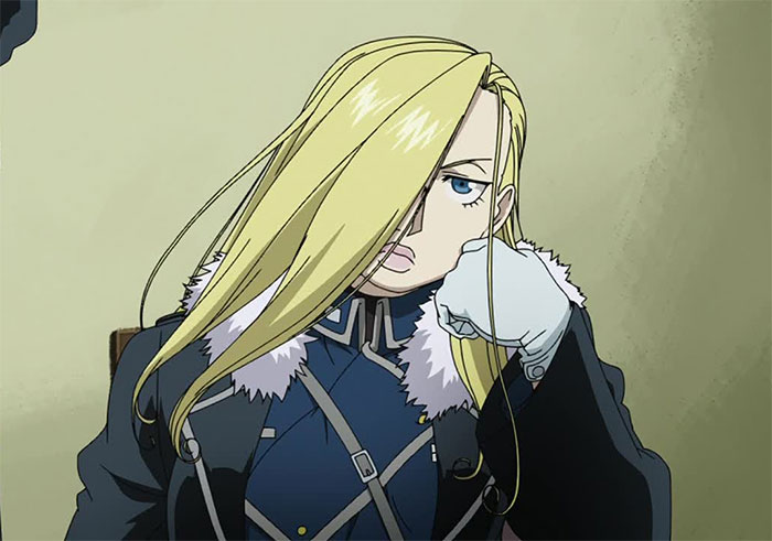 Olivier Mira Armstrong wearing blue and black jacket