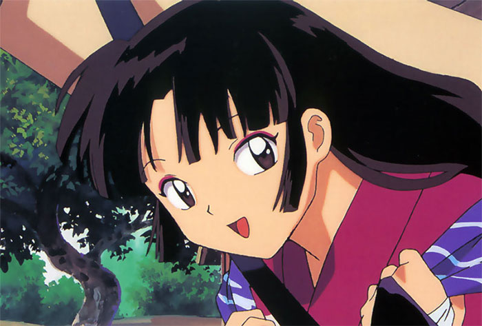A favorite female anime character smiling, wearing a pink and blue outfit, with trees in the background.