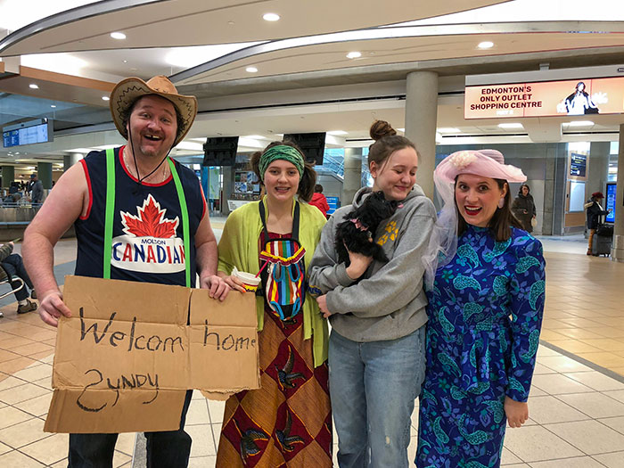 We Decided To Embarrass Our Daughter At The Airport After 3 Months Away. (We Don't Normally Dress This Way)