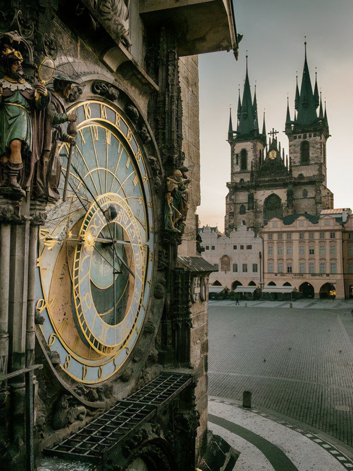 Prague, Czech Republic. Astronomical Clock On Old Town Square And Church Of Our Lady Before Tyn At Golden Hour