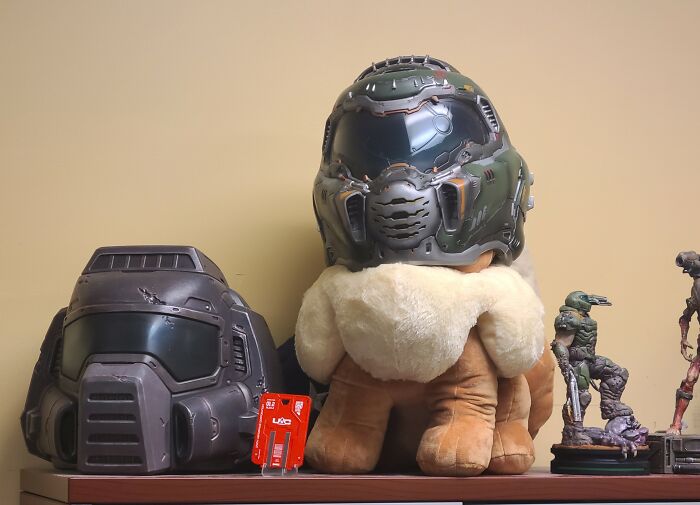 I Bought A 24 Inch Plush Eevee To Bring Into My Office And Put A Doom Slayer Helmet On It.