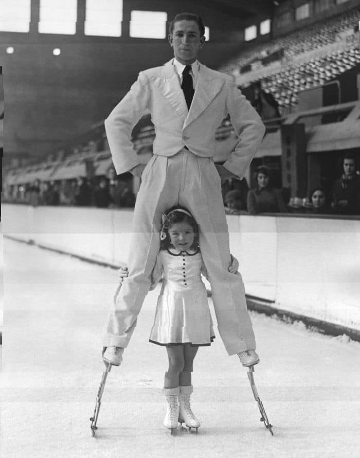 Walking On Stilts Is Already Impressive Enough, But This Man Pushed It One Step Further And Skated On Stilts! Fritz Dietl, Who Was Better Known As The Stilt-Man, Was Photographed Practicing His Skills With Four-Year-Old Pat Kemp At The Empire Pool In Wembley. 1937