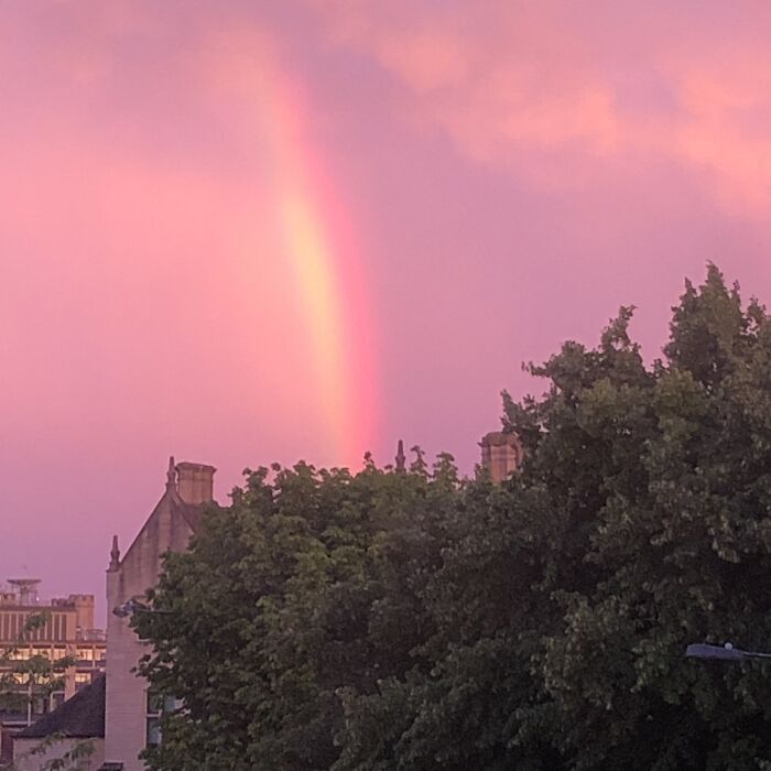 A Big Rainbow Through A Pink Sunset