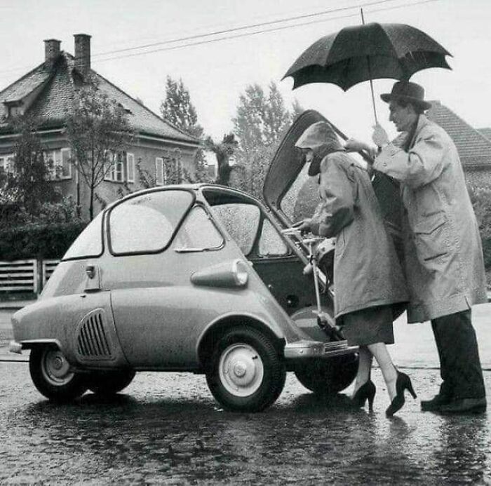 A Couple Gets Into Their Bmw Isetta, Through The Front Door, 1950