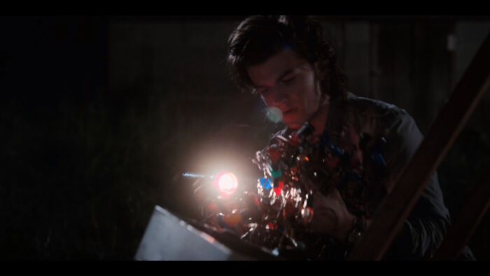In The Last Episode Of Stranger Things 2, Steve Casually Tosses Aside Christmas Lights While Sorting Through Junk From The Shed
