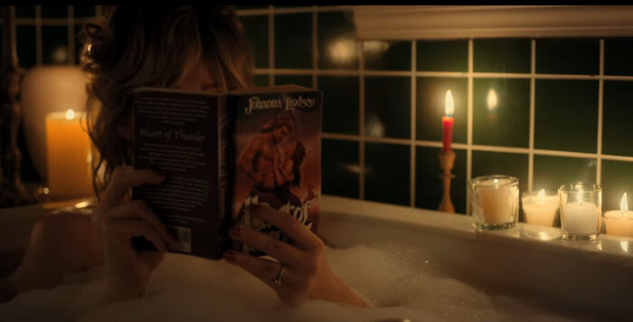 In S02e09 Of Stranger Things, Right Before Mrs. Wheeler Meets Billy For The First Time, She's Reading A Romance Novel That Has A Man That Looks Exactly Like Billy On The Cover