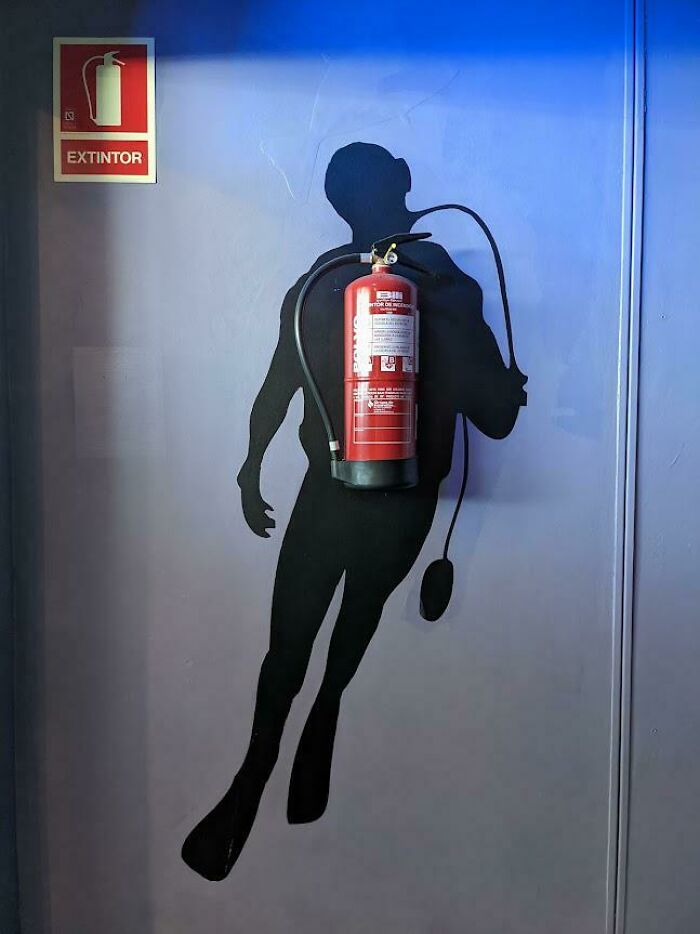 Clever Design Incorporating A Fire Extinguisher At An Aquarium