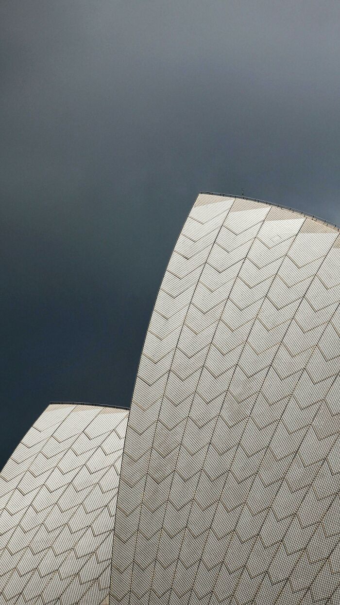 The Fine Tile Details Of The Sydney Opera House Roof With A Dark Sky In Contrast