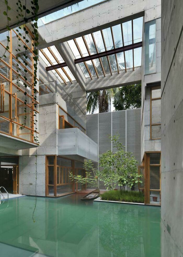 Modern Concrete Built House With Indoor Pool Designed To Look Like A Lake