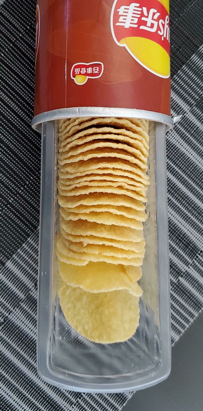 This Can Of Chips Has A Plastic Slider So You Can Easily Reach The Ones At The Bottom