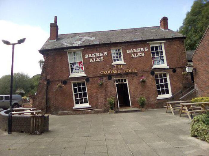 This Pub Was Completed In 1765 Was Built On Top Of A Mine Shaft And Over Time It Had Sank On One Side. Getting In Sober Is A Challenge, And Even Harder Getting Out Drunk