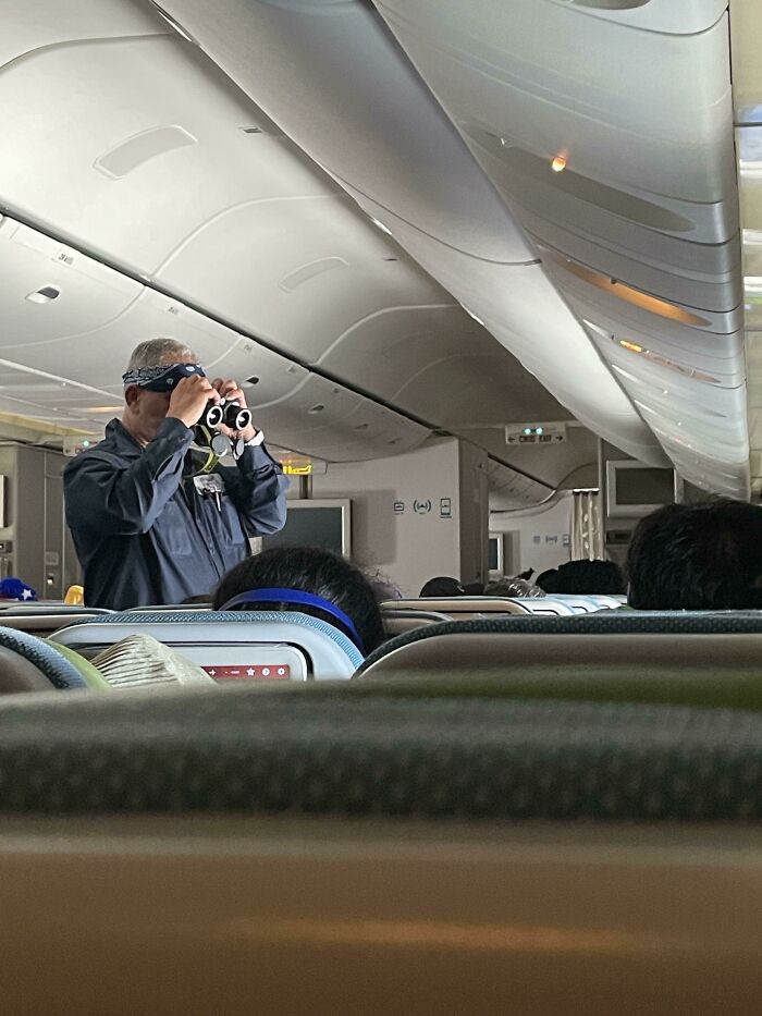 This Guy On My Flight To Chicago From Istanbul Looking Out The Window With Binoculars From The Aisle