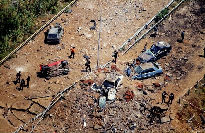 The Scene On The Highway Near Palermo After A Bomb Killed Anti-Mafia Judge Giovanni Falcone, His Wife, And Three Police Escort Agents On 23rd May 1992. The Bombing Was A Terror Attack By The Sicilian Mafia Who Placed 400 Kg Of Explosives Under The Highway (Sicily, Italy 1992) 