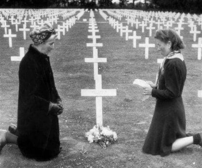 Memorial Day 1945: French Teen Helene Chapelle And Her Mother Kneel At The Grave Of James Simonian Who Was Killed During The Normandy Invasion
