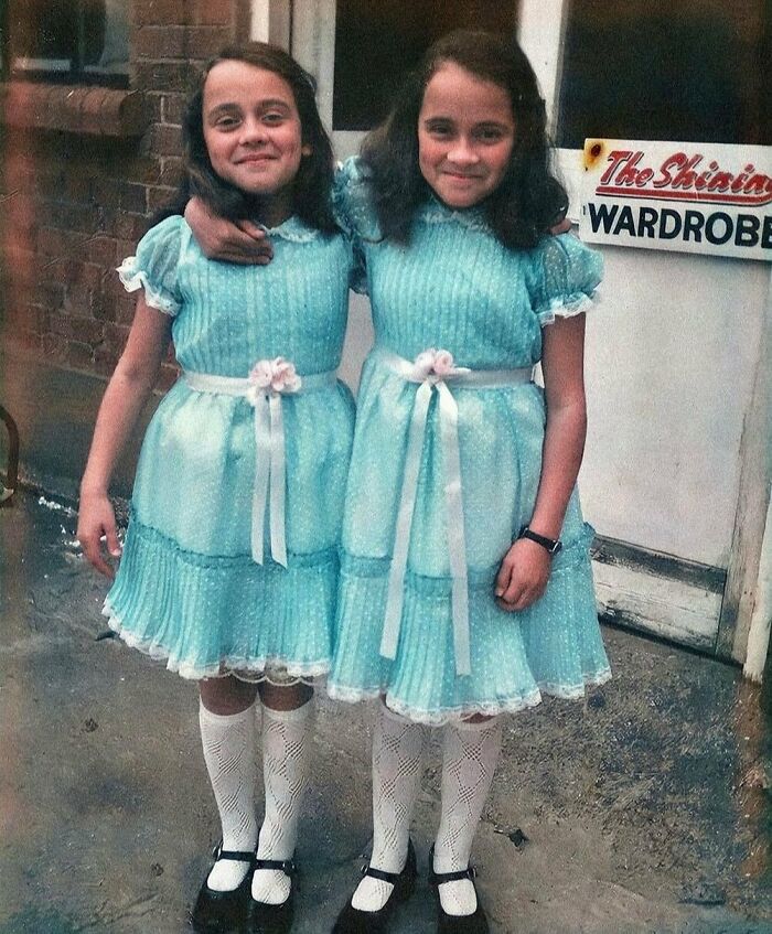 Lisa & Louise Burns, Aka The Grady Twins From The Shining (1980), Posing In Their Costumes Outside The Wardrobe Department On Set