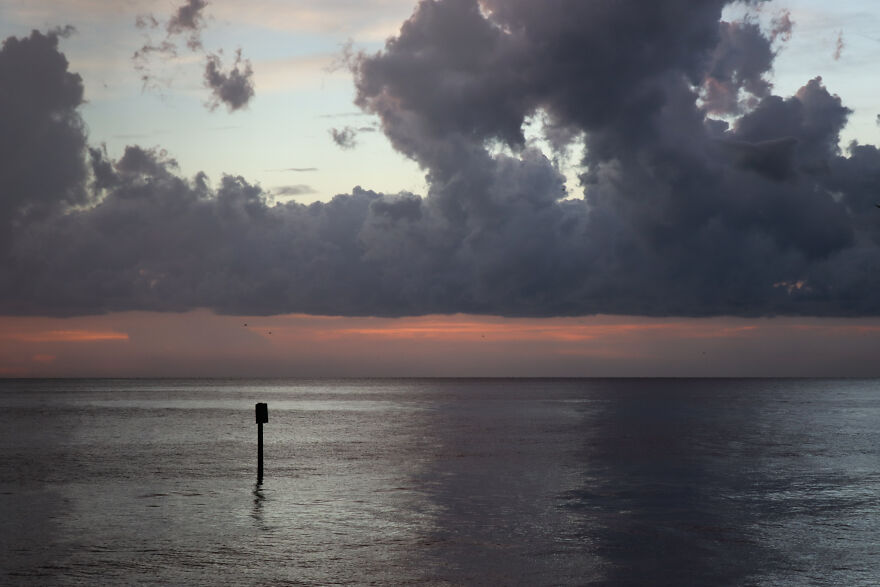 Still Water Under A Pink-Streaked Sky